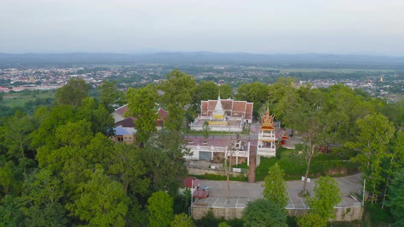 Aerial view of golden buddha pagoda stupa. Wat Phrathat Khao Noi Temple Park, Nan