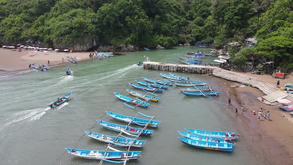 Aerial view of traditional boats in lagoon beach in Indonesia