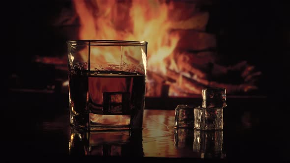 Glass of Alcohol Near the Fireplace