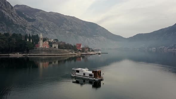 Aerial view of floating house in Boko-Kotorskaya Bay in Montenegro