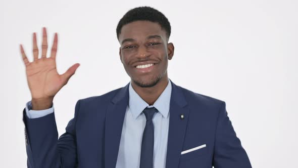 Welcoming African Businessman Waving Hand on White Background