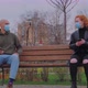 Man and Woman Sitting on Park Bench Take Off Their Protective Masks and Begin to Communicate - VideoHive Item for Sale