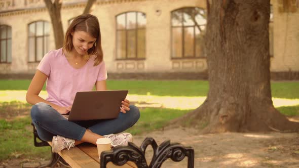 Young Woman Use Computer Near College