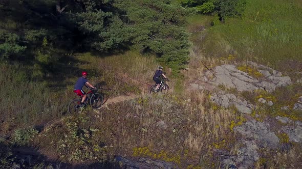 Men Running on a Mountain Bike