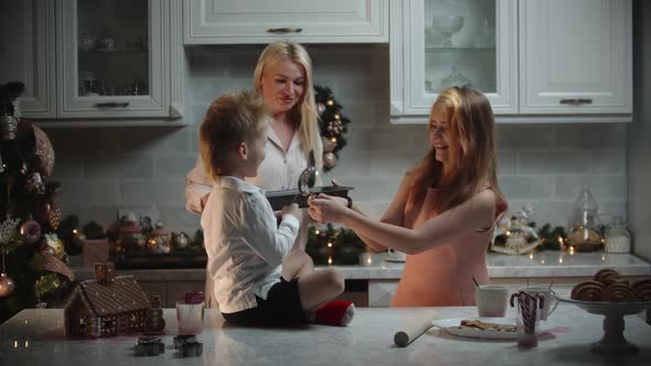 Family Christmas  Mother and Her Children Making Cookies  Kids Playing