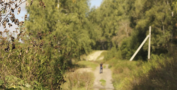 Man Walks On Willage Road
