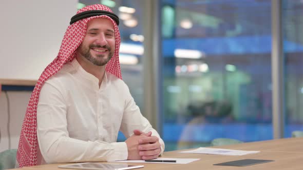 Smiling Arab Businessman Looking at Camera