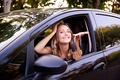 Happy young woman in car - PhotoDune Item for Sale