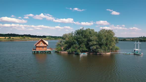 Green island and a house on water