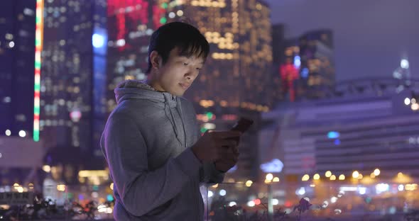 Man use of tablet computer at night