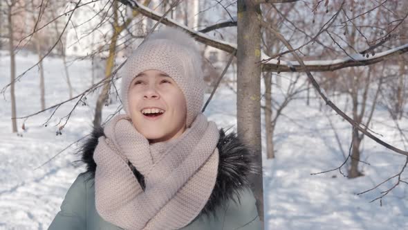 Girl By Snow Covered Trees