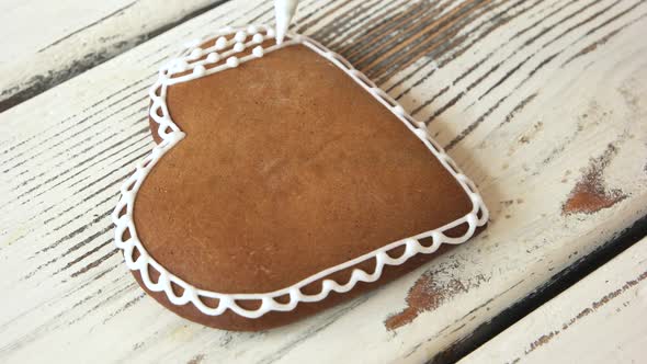 Piping a Lace on Fresh Gingerbread Cookie