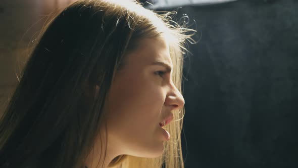 Profile of Beautiful Girl Singing in Sound Studio