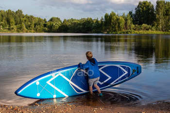 ver. Rest. A boat with an oar. Holidays. Greens. Swimming. Puddle board.