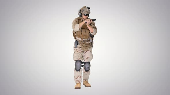 Soldier Walking and Aiming with a Pistol on Gradient Background.