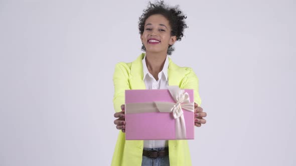 Happy Young Beautiful African Businesswoman Giving Gift Box