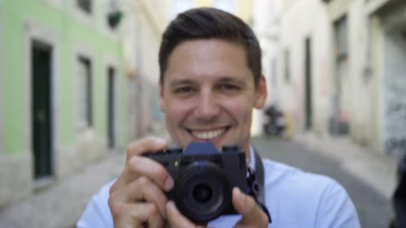 Happy Cheerful Young Man Taking Pictures