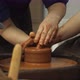 Closeup of Adult and Child's Dirty Hands Molding Clay Into Ceramic Pot - VideoHive Item for Sale