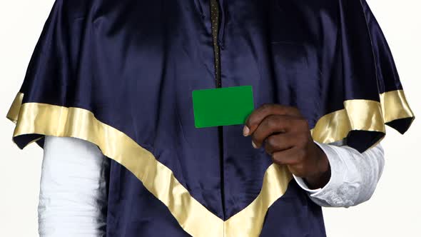 Student Holding a Green Card and Shows the Thumb. White. Close Up