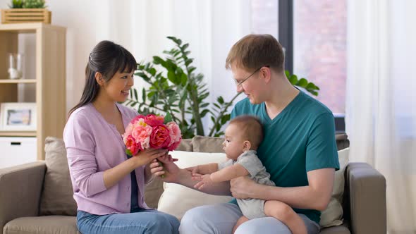 Happy Family with Flowers and Baby Boy at Home 15