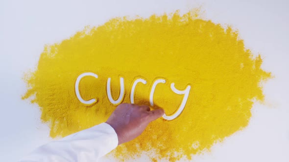 Hand Writes Turmeric Curry