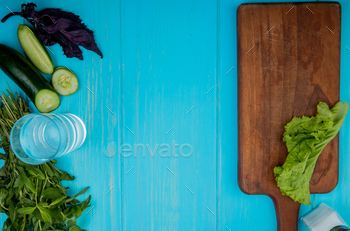 top view of vegetables as mint, cucumber, basil with detox water and lettuce on cutting board on / Photodune, Misc