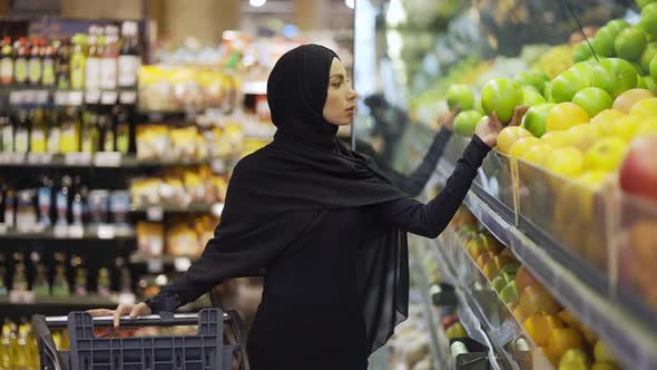 A Muslim Woman Shopping for Groceries at Supermarket