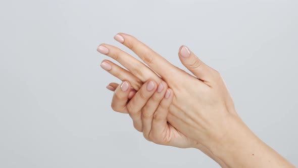 Beautiful female hands studio close-up. Arms of young woman.