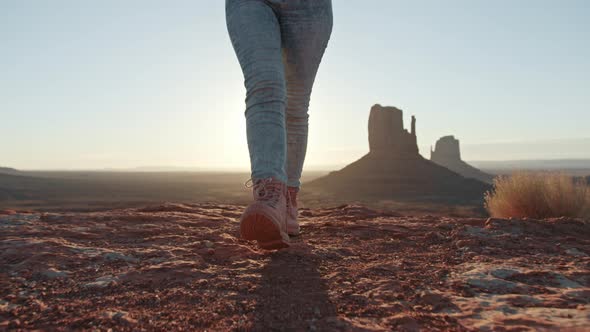 Nature Adventure Summer Trip Following Woman in Boots Hiking By Dusty Mountain