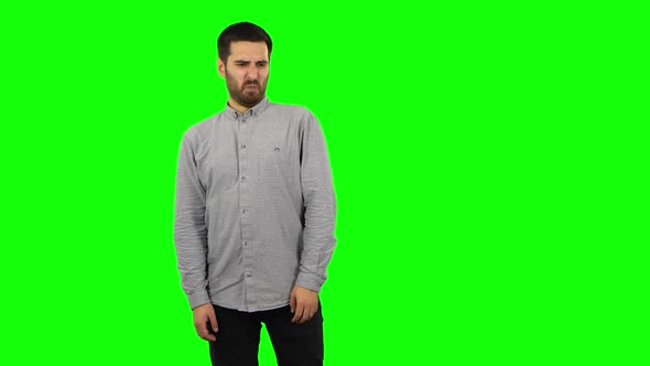 Brunette Guy Is Showing Disgust for Bad Smell or Taste. Green Screen