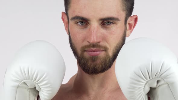 Bearded Male Boxer Smiling To the Camera, Standing in Fighting Stance