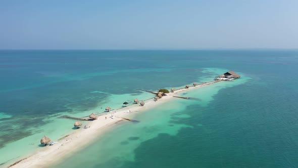 Beautiful Beach with White Sand Turquoise Ocean Blue Sky on a Sunny Day Aerial View