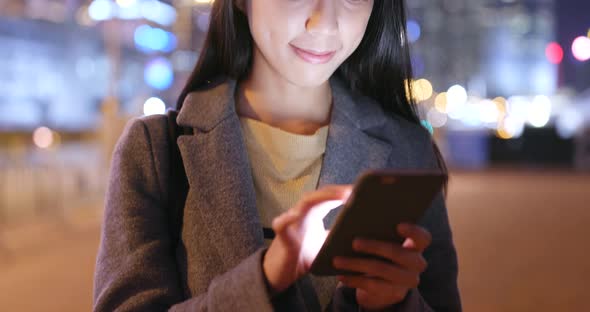 Woman use of cellphone at night