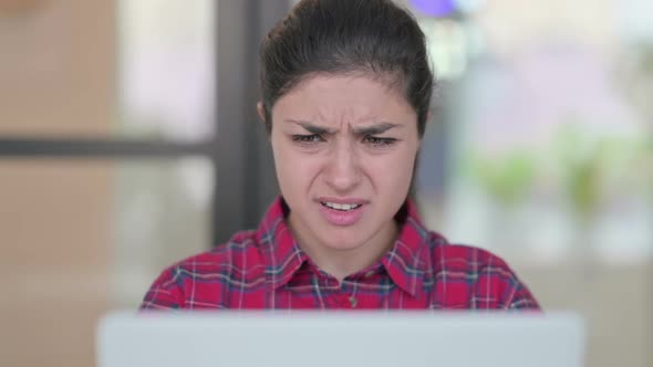 Close Up of Indian Woman Reacting to Loss on Laptop