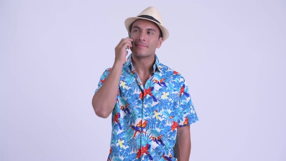 Young Happy Hispanic Tourist Man Talking on the Phone