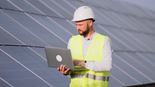 Engineer Working Use Laptop Stand Near Solar Batteries Construction Renewable Power Worker Man