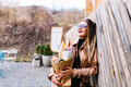 Half-turned photo of attractive woman with paper bag of tasty meal from supermarket. Charming girl c - PhotoDune Item for Sale