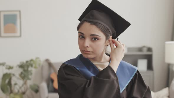 Female Graduate Getting Ready for Graduation Ceremony