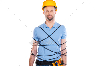 ped in wire holding drill and keeping eyes closed while standing against white background