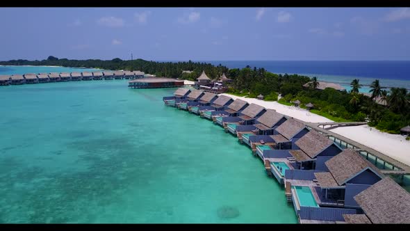 Aerial seascape of perfect island beach trip by blue ocean with white sand background of a dayout ne