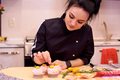 Young woman preparing cupcakes - PhotoDune Item for Sale