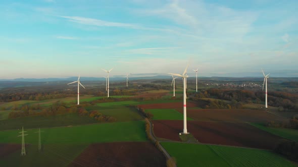 drone flight over wind turbine park in a rural landscape