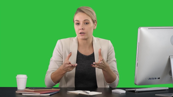 Beautiful young businesswoman giving a speach to the camera