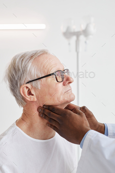 eck of senior man during examination in hospital room, side view