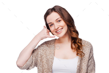 camera and gesturing mobile phone near ear while standing isolated on white
