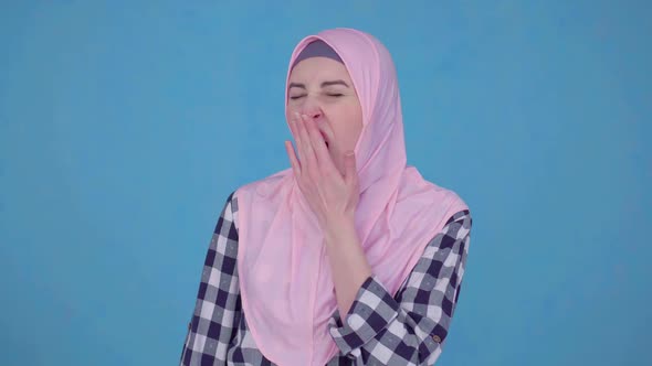 a Young Muslim Woman Sleepy Yawns of the Early Morning Rise