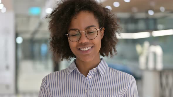 Smiling African Businesswoman Looking at Camera 