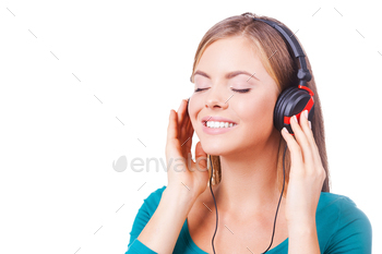  holding hands on headphones and smiling while standing against white background