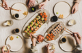 Hands of people enjoying Japanese meal with sushi at home - PhotoDune Item for Sale
