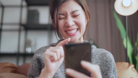 social media enjoy,asian female adult smile laugh hand seach surf smartphone device